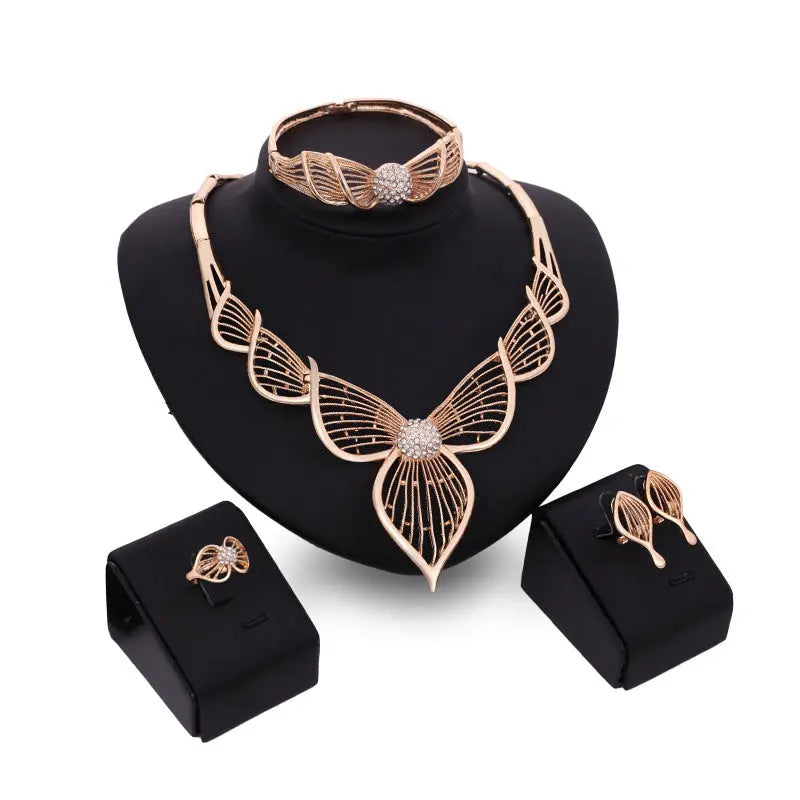 Elegant Four-piece Leaf Bridal Wedding Jewelry Set Add a touch of elegance to your bridal look with this Elegant Four-piece Leaf Bridal Wedding Jewelry Set. - Nuriyya Bridal Accessories LLC